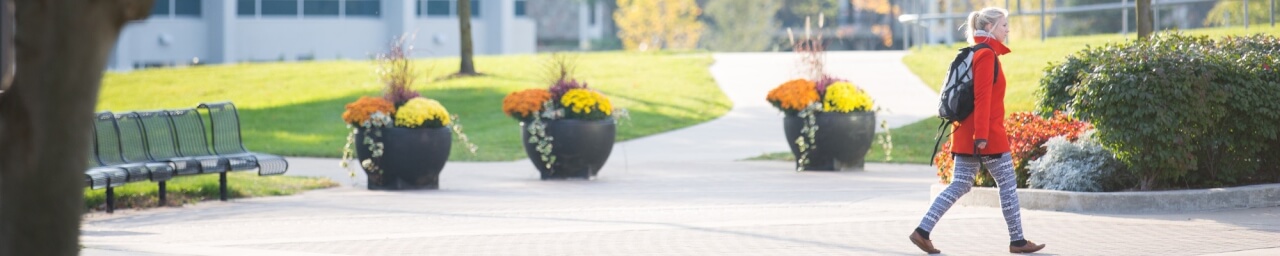 Female student walking through campus